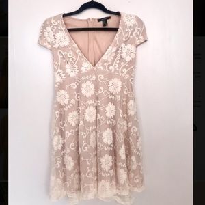 White lace over nude mini dress